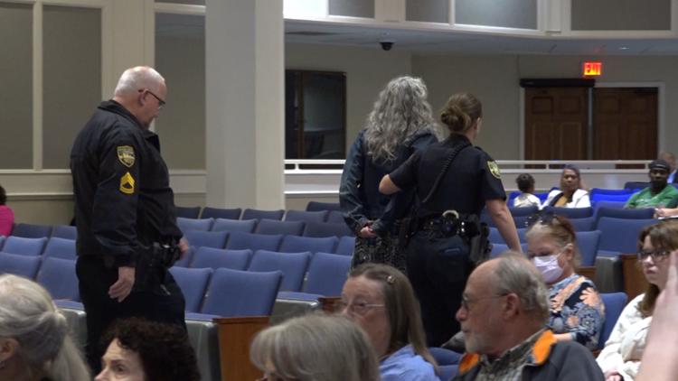 Jacksonville woman claims rights violated after being removed from city meeting for political shirt — First Coast News Local
